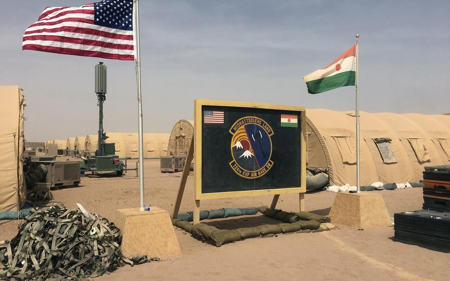 U.S. and Niger flagd are raised side by side at the base camp for air forces and other personnel supporting the construction of Niger Air Base 201 in Agadez, Niger, April 16, 2018. 