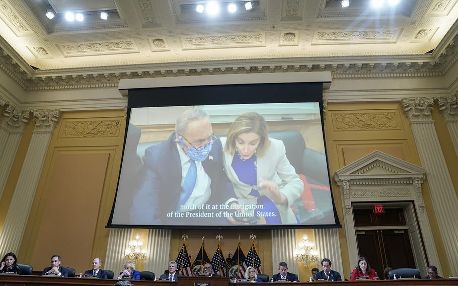 Senate Majority Leader Charles E. Schumer, D-N.Y., and House Speaker Nancy Pelosi, D-Calif., are seen on a video screen during the House select committee hearing making calls from a secure location while the Capitol was being attacked on Jan. 6, 2021. 