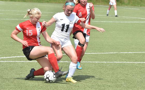 American Overseas School of Rome's Clara Clayton breaks up an attack from Naples' Emma Kasparek in the DODEA-Europe girls Division II soccer championships on Tuesday, May 17, 2022, at Landstuhl, Germany.