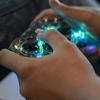 A closeup of hands using a video game controller.