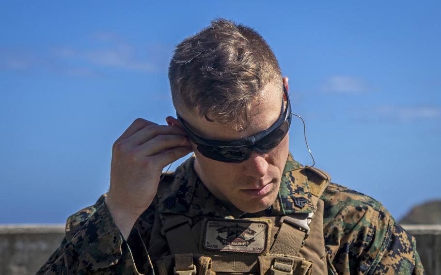 U.S. Marine Corps Sgt. Nicholas Meuse plugs his ears at a grenade range at Marine Corps Base Hawaii in 2020. Loud noises are one of the biggest risk factors for tinnitus, which is the most prevalent disability among U.S. veterans