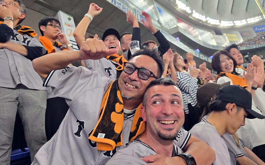 Michel Sauret makes new friends during a Yomiuru Giants game at Tokyo Dome, May 24, 2025.