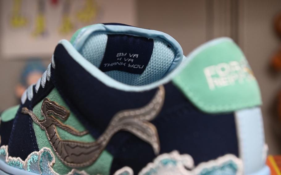 “By VA 4 VA Thank You” reads on the inside tongue of Petty Officer 2nd Class Kenneth Jones’ custom created sneaker in Norfolk, Virginia, Nov. 29, 2023.