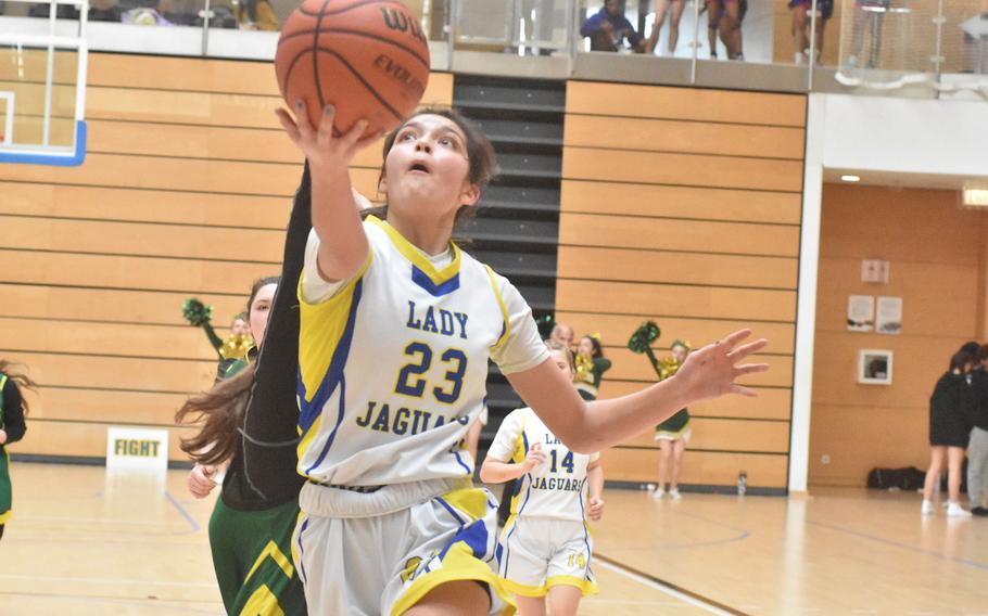 Sigonella’s Ryleigh Denton tries a scoop shot Thursday, Feb. 15, 2024, at the DODEA European Division III Basketball Championships in Wiesbaden, Germany.