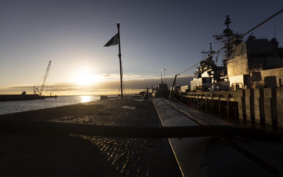 The sun sets on the USS Pasadena at Naval Station Norfolk on Jan. 31, 2024. The USS Pasadena, a Los Angeles-class fast attack submarine, is undergoing a scheduled maintenance at Naval Station Norfolk, Va.