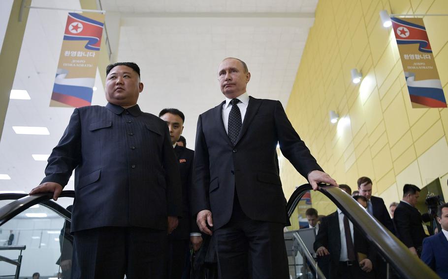 Russian President Vladimir Putin and North Korean leader Kim Jong Un ride an escalator following their talks at the Far Eastern Federal University campus on Russky island in the far-eastern Russian port of Vladivostok on April 25, 2019.