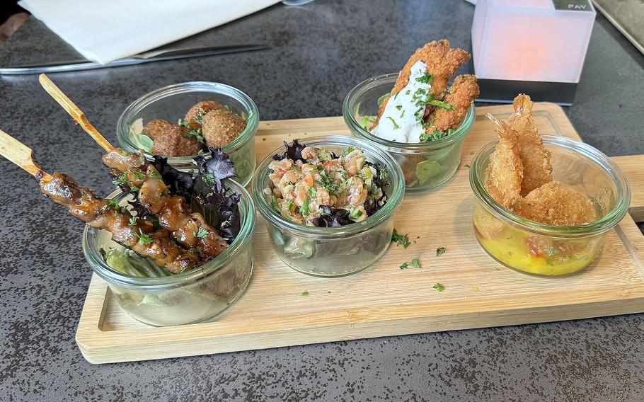 The tapas appetizer at Schlemmerwerk im Kipperhof in Otterbach, Germany, from left: chicken in teriyaki sauce' falafel in sweet and sour sauce; salmon tartare; fried chicken with yogurt sauce and fried shrimp in mango sauce.