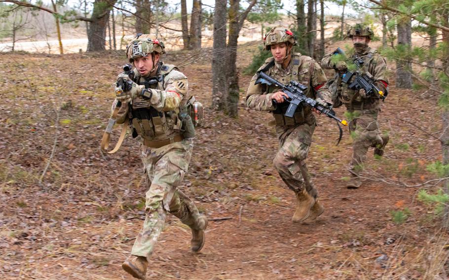 U.S. Army soldiers with Charlie Company, 3rd Battalion, 67th Armored Regiment, 2nd Armored Brigade Combat Team, 3rd Infantry Division, execute tactical movement on an urbanized terrain during the Strong Griffin exercise at Pabrade Training Area, Lithuania, Nov. 17, 2023. Strong Griffin 2023 saw Task Force Marne Soldiers serve as an opposing fighting force for the Griffin Brigade of the Lithuanian Armed Forces, which provided an opportunity to share Allied tactics and strategies.