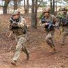 U.S. Army Soldiers with Charlie Company, 3rd Battalion, 67th Armored Regiment, 2nd Armored Brigade Combat Team, 3rd Infantry Division, execute tactical movement on an urbanized terrain during the Strong Griffin exercise at Pabrade Training Area, Lithuania, Nov. 17, 2023. Strong Griffin 2023 saw Task Force Marne Soldiers serve as an opposing fighting force for the Griffin Brigade of the Lithuanian Armed Forces, which provided an opportunity to share Allied tactics and strategies. The 3rd Infantry Division’s mission in Europe is to engage in multinational training and exercises across the continent, working alongside NATO allies and regional security partners to provide combat-credible forces to V Corps, America’s forward deployed corps in Europe. (U.S. Army photo by Sgt. Cesar Salazar Jr.)