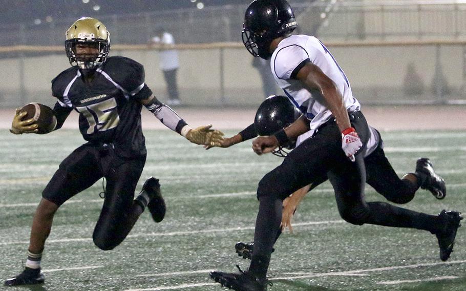 Humphreys Gold's Darryl Veal tries to elude Osan's Jaylon Grant.