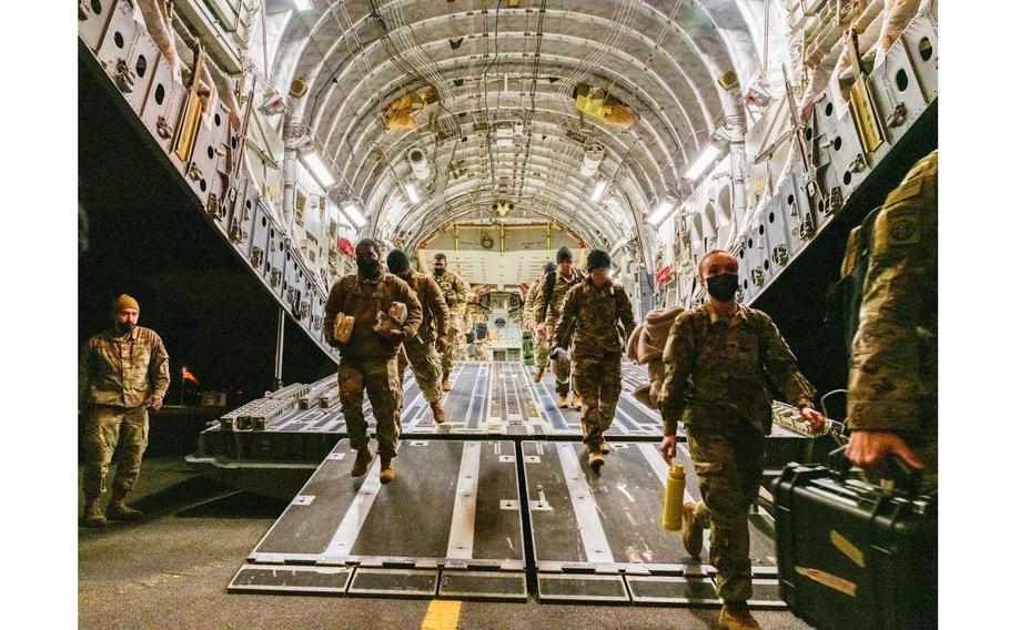 Soldiers arrive at Wiesbaden, Germany, Feb. 4, 2022, where the 18th Airborne Corps will establish a Joint Task Force-capable headquarters as 1,700 paratroopers deploy to Poland. The deployment is in response to Russia's troop buildup along Ukraine's borders.