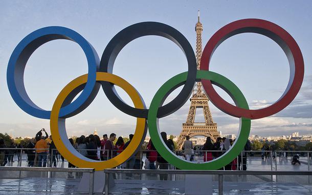 FILE - The Olympic rings are set up at Trocadero plaza that overlooks the Eiffel Tower, a day after the official announcement that the 2024 Summer Olympic Games will be in the French capital, in Paris, Thursday, Sept. 14, 2017. A new-round ticketing sale kicked off Thursday for Paris Olympics next year. Only the lucky winners of a lottery will be able to buy about 1.5 million seats for the most prestigious competitions, as well as the opening and closure ceremonies. (AP Photo//Michel Euler, File)