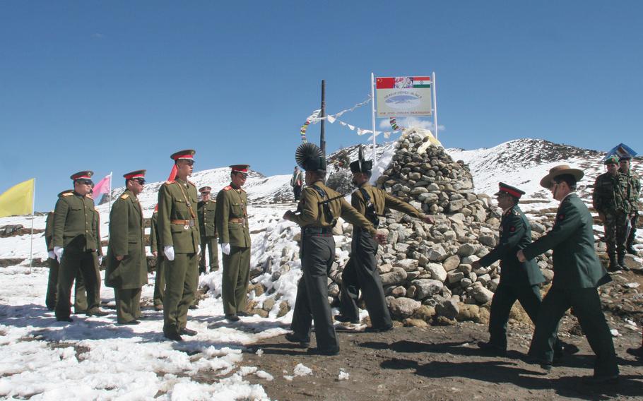 An Indian army delegation marches to meet a Chinese army delegation on the Chinese side of the Line of Actual Control at Bumla, Indo-China Border, on Oct. 30, 2006. Indian and Chinese commanders met Wednesday, Jan. 12, 2022, on China’s side of the Moldo meeting point for the 14th round of talks in hopes of easing a 20-month standoff.