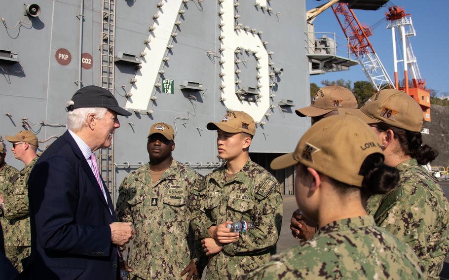 Sen. John Cornyn, R-Texas, meets with sailors on the flight deck of the aircraft carrier USS Ronald Reagan at Yokosuka Naval Base, Japan, Tuesday, April 12, 2022. 