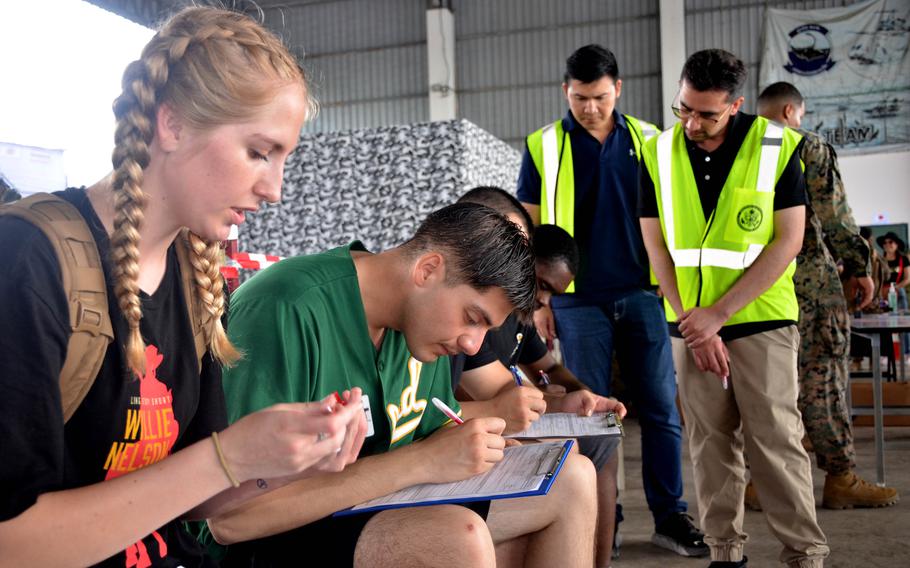 Members of the 15th Marine Expeditionary Unit role play as civilian evacuees during the Cobra Gold exercise in Rayong, Thailand, on March 3, 2024. 