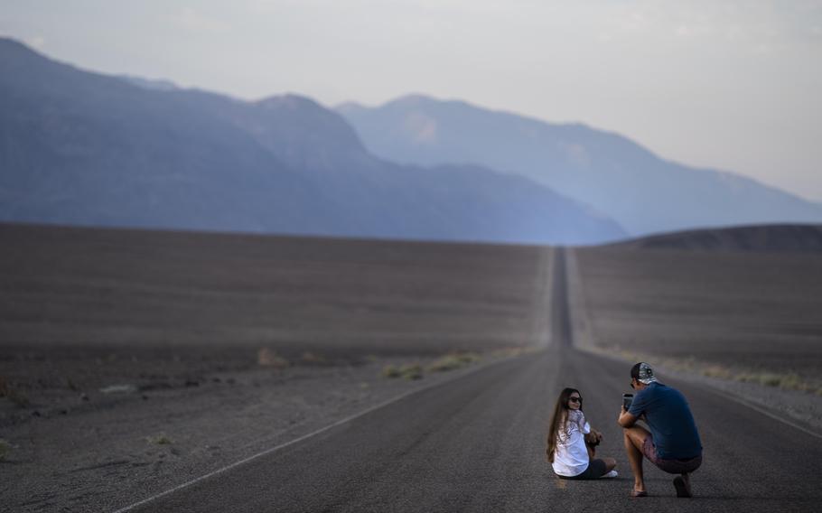 Tourists from Moldova stop to take pictures along Badwater Road early Saturday. 