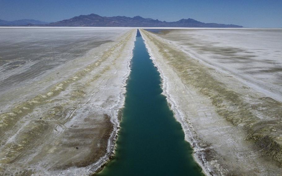 The Intrepid Potash canal is shown at the Bonneville Salt Flats on Monday, Aug. 29, 2022, near Wendover, Utah. Potash is potassium-based salt primarily used throughout the world as a fertilizer for crops such as corn, soy, rice and wheat. It’s extracted in 13 countries throughout the world, mainly from prehistoric lakebeds like Bonneville’s. 