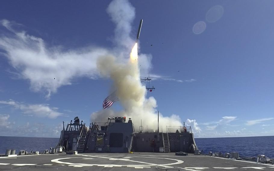 A tomahawk land attack missile is launched aboard the Arleigh Burke-class guided-missile destroyer USS Curtis Wilbur (DDG 54) in the Philippine Sea on May 27, 2019.