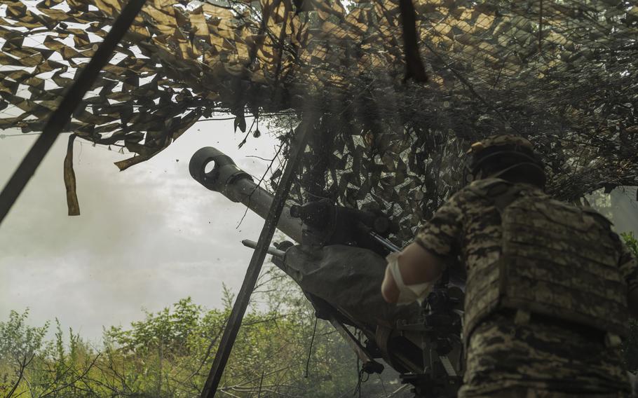 An artillery unit of the Ukrainian Air Assault Forces fires a British-made L119 howitzer at Russian infantry on the eastern front in Ukraine on June 24, 2023. 