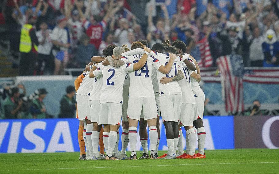 Members of the U.S. men’s national team huddle after losing to the Netherlands in World Cup competition on Saturday, Dec. 3, 2022.