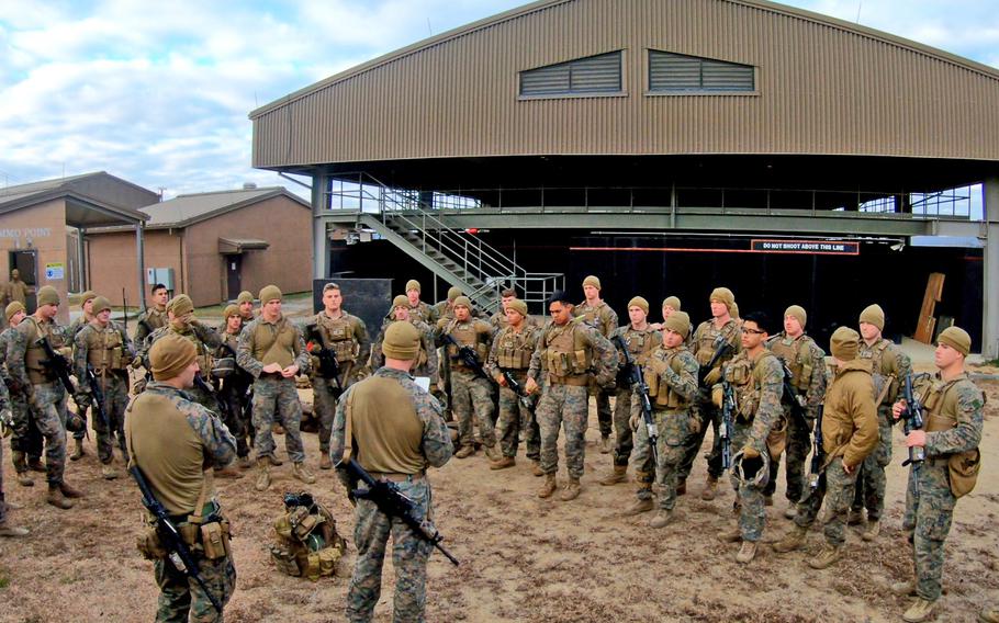 Marines stand in a group together