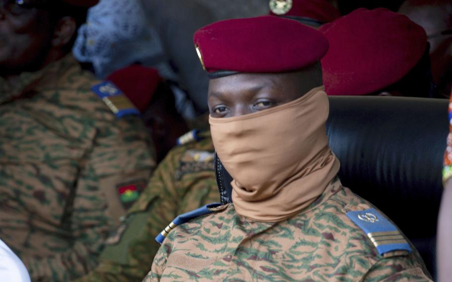 Burkina Faso coup leader Capt. Ibrahim Traore participates in a ceremony in Ouagadougou, Oct. 15, 2022. Just weeks after Burkina Faso's junta ousted hundreds of French troops, there are signs that the West African country could be moving even closer to Russia, including the mercenary outfit, the Wagner Group.