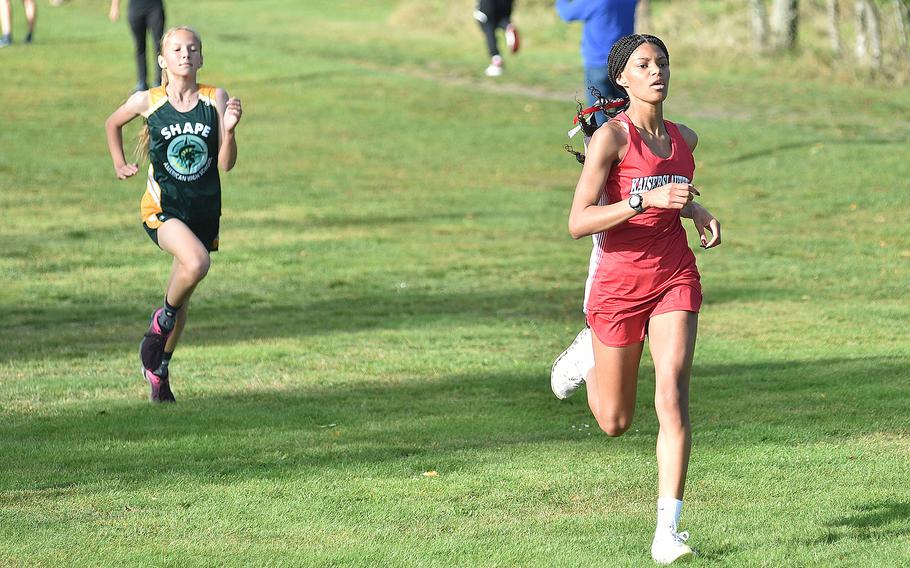 Kaiserslautern runner Samantha Ramsey leads SHAPE's Iveta Stefancinova to the line during an Oct. 14, 2023, race at Rolling Hills Golf Course at Baumholder, Germany. Ramsey held off Stefancinova to win the girls race in a time of 21:24.