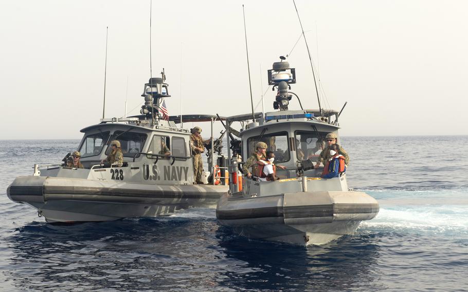 A U.S. Navy Maritime Expeditionary Security Squadron Eleven patrol boat based at Camp Lemonnier, Djibouti, pulls away from USNS Patuxent, not seen, with four Somali fishermen on board, on June 17, 2021. The fishermen were rescued by U.S. sailors a day earlier after being stranded at sea for 12 days.