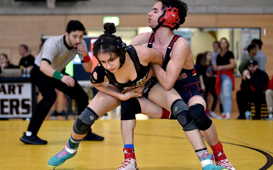 Kaiserslautern's Jaden Calixto controls Stuttgart's Karmyn Lopez in a 106-pound match during a DODEA wrestling sectional meet on Feb. 3, 2024, at Stuttgart High School in Stuttgart, Germany.