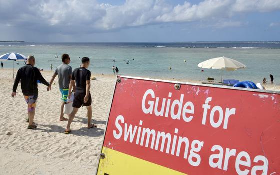 People visit Sesoko Beach on Okinawa, Oct. 28, 2022.