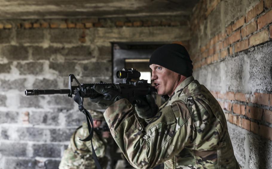 Sgt. Burton Holloway of the 278th Armored Cavalry Regiment with the Tennessee National Guard deployed to Ukraine to demonstrate room clearing procedures in Yavoriv, Ukraine, Nov. 15., 2018.