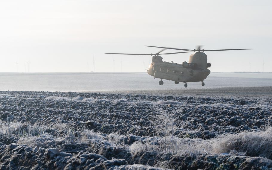 A U.S. Army CH-47 Chinook helicopter  from the 214th Aviation Regiment takes off from Alzey drop zone, Ober-Flörsheim, Germany, Dec. 13, 2022. 