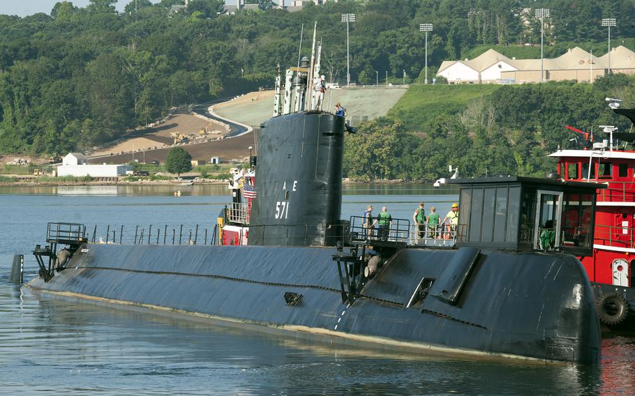 The Nautilus arrives at the Submarine Force Museum in Groton, Conn., Thursday, Aug. 4, 2022, near the end of its $36 million preservation project.