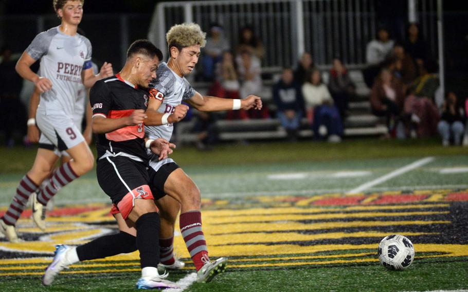 Damian Perez and Ren Spinosi battle for the ball.