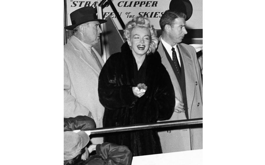 Shown upon arrival at Tokyo International Airport are (left to right) Frank (Lefty) O’Doul, baseball manager; newlywed film star Marilyn Monroe, and her husband, former Yankee baseball great, Joe DiMaggio. 