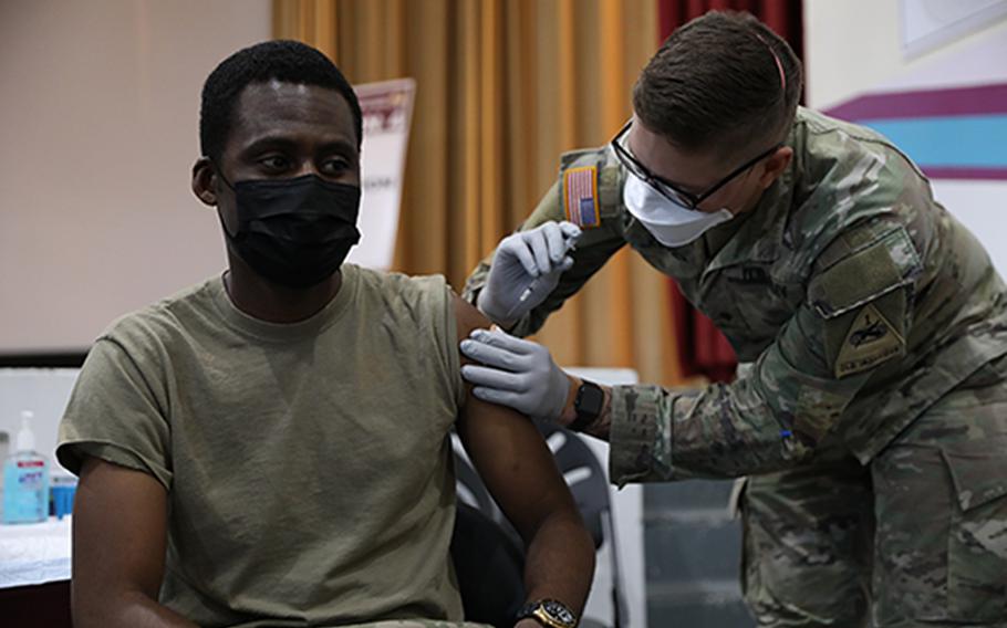 Army Maj. Bielosa Aworh, assigned to the 24th Theater Public Affairs Support Element, receives a coronavirus vaccination at the Stayton Theater at Fort Bliss, Texas, on Feb. 5, 2021.  The Army announced Friday, March 11, 2022, that for the first time the service has granted a soldier a permanent religion-based exemption from taking the mandatory coronavirus vaccine.