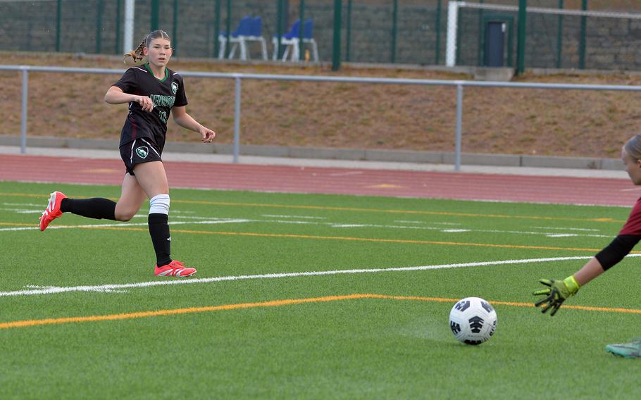 AFNORTH’s Clara Pacios watches her shot roll past the outstretched hand of Sigonella keeper Summer Planitz in the Division III girls final at the DODEA-Europe soccer championships in Ramstein, Germany, May 22, 2025. The Lions beat Sigonella 4-2.