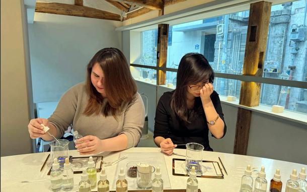 Guests create personalized fragrances during a perfume-making class at Proust Scent in Seoul, South Korea, July 1, 2025. 
