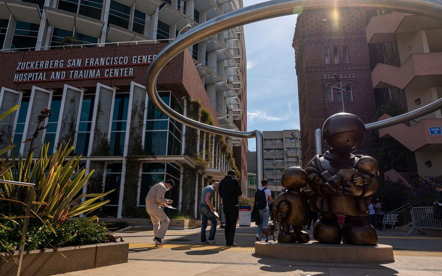 Residents wait in line to receive a monkeypox vaccination at the Zuckerberg San Francisco General Hospital And Trauma Center in San Francisco on Aug. 2, 2022.