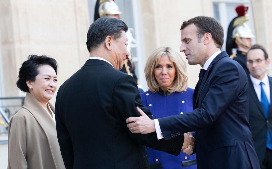 Emmanuel Macron, France’s president, right, bids farewell to Xi Jinping, China’s president, in the courtyard of Elysee Palace in Paris on March 26, 2019.