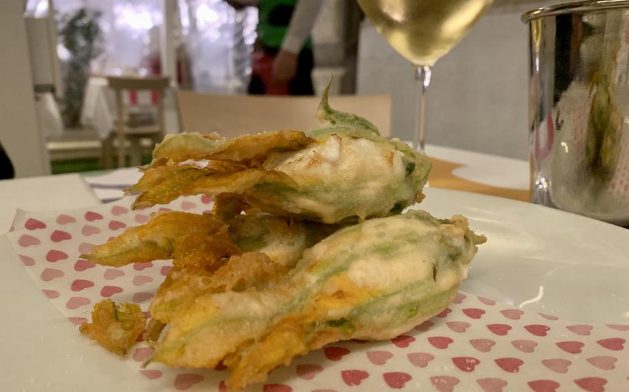 An appetizer of fried zucchini flowers at Muu Mozzarella in Naples, Italy is stuffed with buffalo ricotta and seasoned with Sichuan pepper.