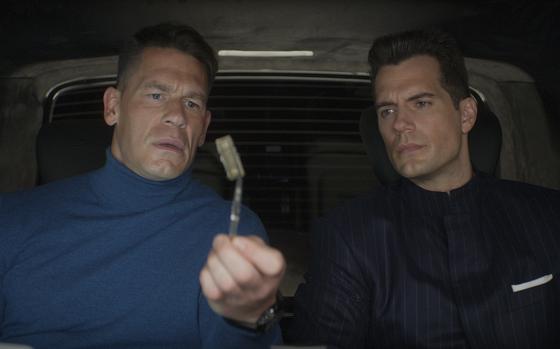 John Cena, left, and Henry Cavill are two of the many stars in the meta spy movie “Argylle.”