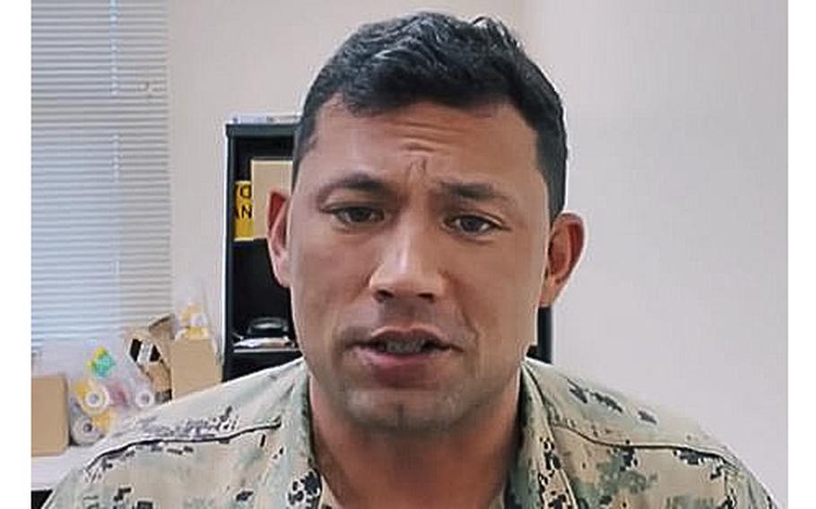 A video screen grab shows Gunnery Sgt. Ian Futrell, a Marine stationed at Marine Corps Air Station Beaufort, S.C., who is being charged with felony child abuse.