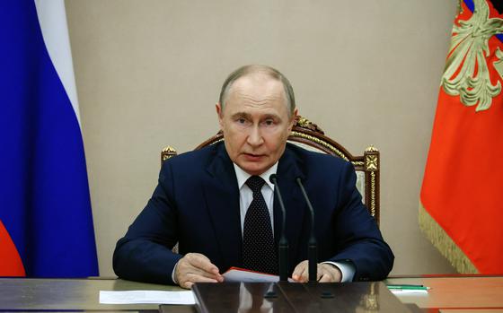 In this pool photograph distributed by the Russian state agency Sputnik, Russia's President Vladimir Putin chairs a Security Council meeting at the Kremlin in Moscow on August 8, 2025. (Mikhail Metzel/Pool/AFP/Getty Images/TNS)