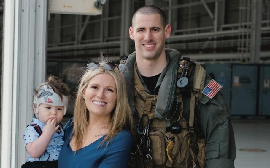 Naval Air Crewman (Helicopter) 2nd Class James P. Buriak, 31, shown here in an undated photo released by the U.S. Navy with his wife Megan, and son Caulder, was from Salem, Virginia. Buriak was one of five Sailors killed when an MH-60S Seahawk helicopter, assigned to Helicopter Sea Combat Squadron 8, crashed approximately 60 nautical miles off the coast of San Diego, Aug. 31.