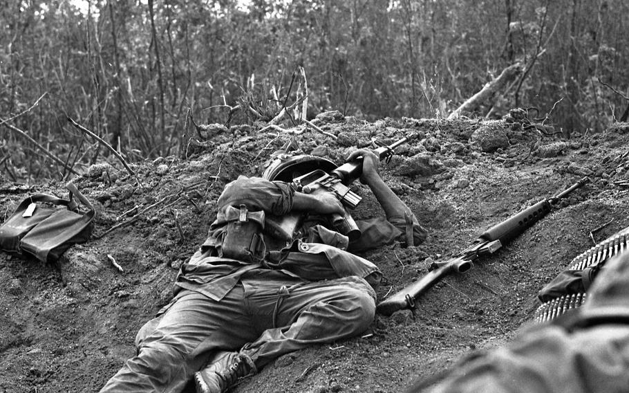 Unidentified soldier takes cover from enemy fire. A combined Infantry and Cavalry mission was halted when the North Vietnamese opened up. The action took place about 2000 meters from Landing Zone Ross, north of Chu Lai. After three hours of air strikes – some hitting as close as 50 meter from the men – the order to withdraw was given. 