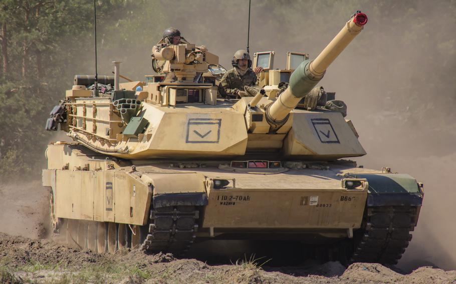 U.S. soldiers maneuver an M1A2 Abrams tank during an exercise in Nowa Deba, Poland, on May 14, 2023. Poland is scheduled to receive 14 Abrams tanks on June 27, according to a statement by Polish Defense Minister Mariusz Blaszczak. More U.S. Abrams tanks will arrive in the coming months, he said.