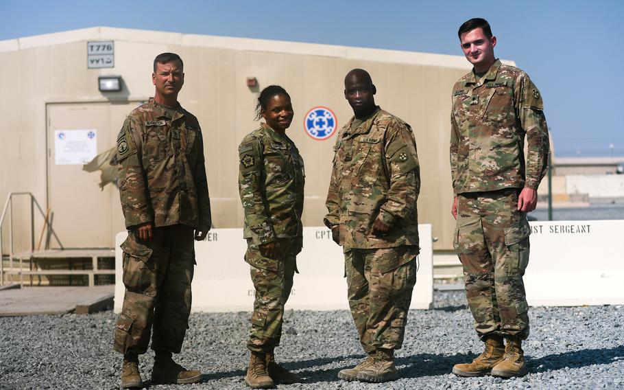 Master Sgt. Lloyd Cossey, Staff Sgt. Steve Augusten, Sgt. Nicole Hall and Spc. Patrick H. Watrous with the Army Reserve's Indianapolis-based 310th Sustainment Command (Expeditionary) returned to Camp Arifjan, Kuwait recently, after providing support to service members at Afghanistan's Bagram Airfield, as the U.S. base closed.