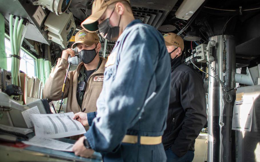 After 16 months helping out at a shipyard overhaul, USS Bataan sailors are back at their regular tasks, like standing a bridge watch.