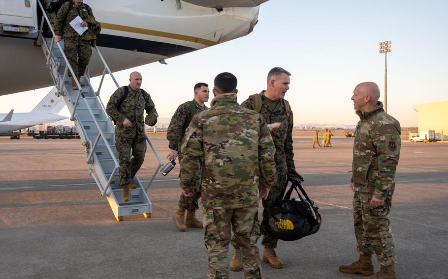 U.S. Marine Corps Brig. Gen. Andrew Priddy, second from right, commander of the 2nd Marine Expeditionary Brigade, speaks with Col. Calvin Powell, 39th Air Base Wing commander, after arriving at Incirlik Air Base, Turkey, Feb. 9, 2023. The joint services are aiding Turkey following a series of earthquakes that struck south-central Turkey on Feb. 6, 2023.